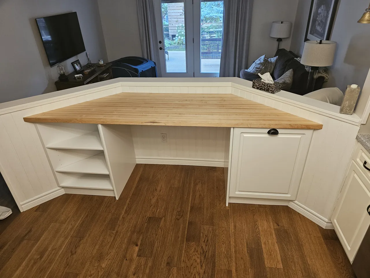 Custom white corner desk with a solid maple butcher block top